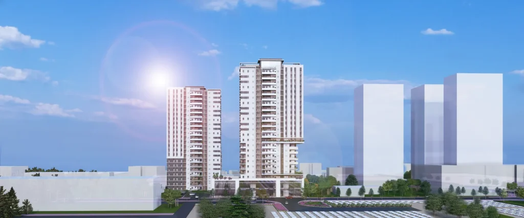 הדמיה אדריכלית של שני מגדלי מגורים מודרניים בפרויקט אור טאון, בלב מתחם עירוני מתחדש, עם חזית מסחרית ושטחים ירוקים מסביב.